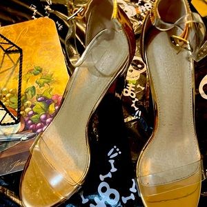 Women’s gold heels.